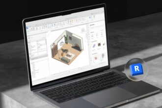 Notebook aberto em uma mesa mostrando o Revit aberto.